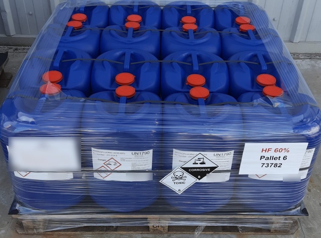 Pallet of blue HDPE jerrycans of HF 60% with UN1790 labels